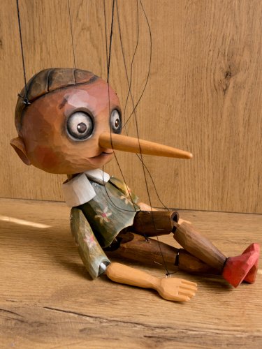 Wooden Pinocchio in green